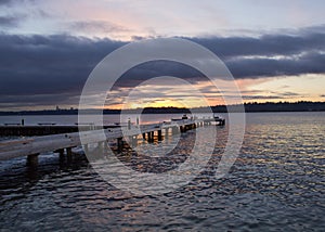 A diagonal view of a pier on a lake in a winter sunset at Waverly Beach Park, Kirkland, Washington