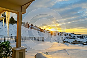Winter sunset from a hillside home in the snow
