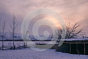 Winter sunset on a humble farmhouse photo