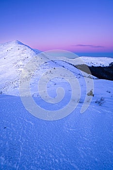 Winter sunset in the mountains. The Mount Halicz, Bieszczady National Park, Poland