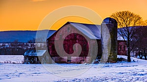 Winter sunset over a barn in rural Frederick County, Maryland. photo