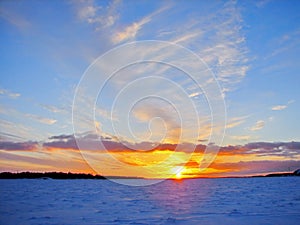 Winter sunset over frozen Baltic Sea in Finland