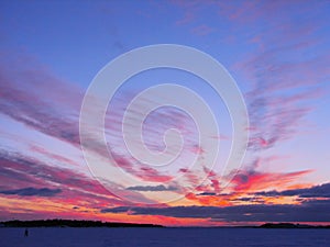 Winter sunset over frozen Baltic Sea in Finland