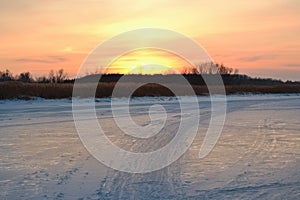 Winter sunset on the river in Russia. The city of Dimitrovgrad, in the Ulyanovsk region