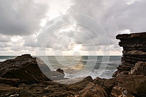 Winter sunset at rocks by the sea. Cavi di Lavagna. Tigullio gulf. Liguria. Italy