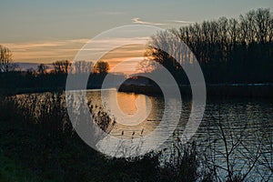 winter sunset sky over Scheldt rivere