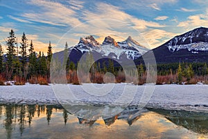 Winter sunset at The Three Sisters, a trio of peaks near Canmore, Alberta, Canada