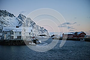 Winter sunset unfrozen sea and Scandinavian houses