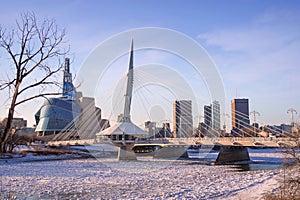 Winter sunset view on Esplanade Riel bridge with Canadian Museum for Human Rights on the background. Winnipeg, Manitoba