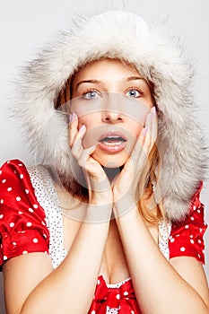 Winter surprise - cute amazed young woman