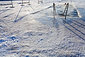 Winter swimming in frozen river