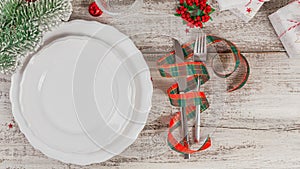 Winter table place setting with Christmas or New Year decorations