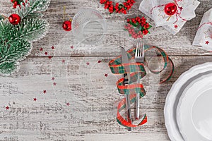 Winter table place setting with Christmas or New Year decorations
