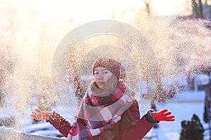 Winter teen girl portrait. Beauty Joyful Model Girl having fun in winter park. Enjoying nature, wintertime