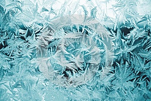 Winter texture of frost on the glass window as a background