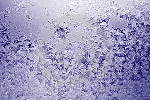 Winter texture of frost on the glass window as a background