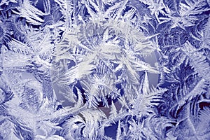 Winter texture of frost on the glass window as a background