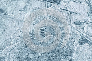 Winter textured background of melting ice block