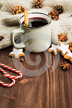 Winter theme. Hot steaming cup of glint wine with spices