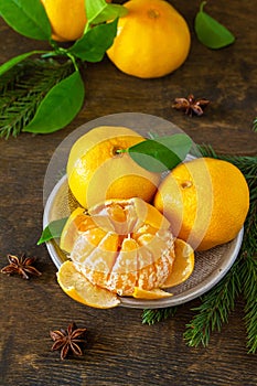 Winter time fruits. Fresh juicy clementine mandarins with leaves.