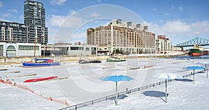 Winter time the marina in Montreal Old Port with boast before condos