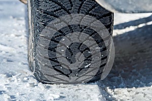 Winter tire tread on snow on a frosty day