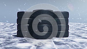 Winter tires on a background of snowstorm, snowfall and slippery winter road. Winter tires concept. Concept tyres