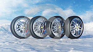 Winter tires on a background of snowstorm, snowfall and slippery winter road. Winter tires concept. Concept tyres