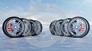 Winter tires on a background of snowstorm, snowfall and slippery winter road. Winter tires concept. Concept tyres