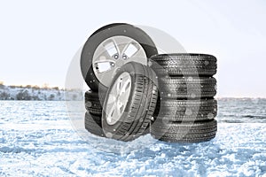 Winter tires and snow on river bank