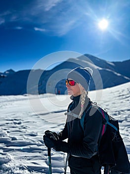 Winter trekker pausing in the serene expanse of the Polish Tatras