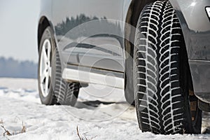 Winter tyres wheels installed on suv car outdoors photo