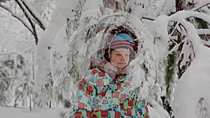 Winter, vacation, games, family concept - slo-mo close up child . Child plays in winter in the park for Christmas vacation.