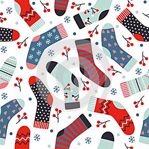 Winter vector seamless pattern with knitted socks, berries and snowflakes. Hand-drawn vector background.