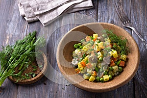 Winter vegetable vegetarian salad with mushrooms, russian salad with homemade mayonnaise