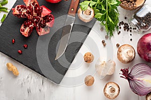 Winter vegetarian, vegan food cooking ingredients. Flat lay of vegetables, fruits, beans, kitchen utensils, olive oil on a white