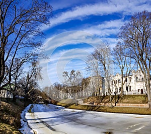 A winter view along a frozen Riga canal in sunny day.