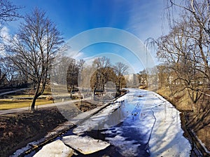 A winter view along a frozen Riga canal in sunny day.