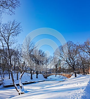 A winter view along a frozen Riga canal in sunny day.