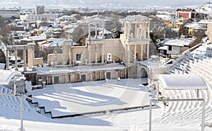 Winter view Ancient Roman theater Philipoppol in Plovdiv city, Bulgaria, Old Town and modern city. Tourist destination