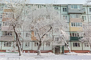 Winter view on courtyard of Khrushchyovka, common type of old low-cost apartment building in Russia and post-Soviet space. Kind of