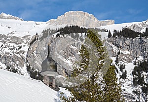 Winter view at a mountain chapel in Engelberg