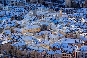 Winter view of snow covered rooftops in the city of Gap. Hautes-Alpes Alps France