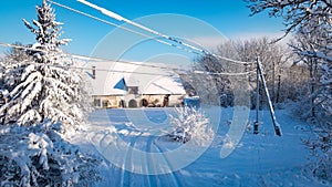 winter view of snowy barn in the village