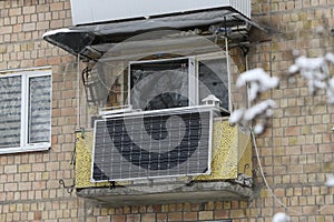 Winter view of the solar battery panel mounted on the balcony of an apartment building in Kyiv, Ukraine