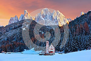 Winter view of the St. Johann Church in Ranui with Puez-Odle Dolomites, Villnoss Val di Funes, South Tyrol, Italy