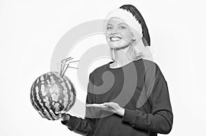 Winter vitamin fruit ration. Strengthen immunity concept. Girl wear santa hat drink watermelon vitamin cocktail straw