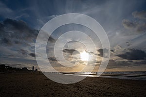 Winter walking on wide sandy beach of North sea near Zandvoort in Netherlands