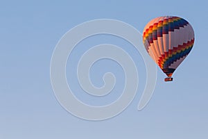 Winter warm dawn with red balloon on hotfire balloons festival, cappadocia, turkey, kappadokya