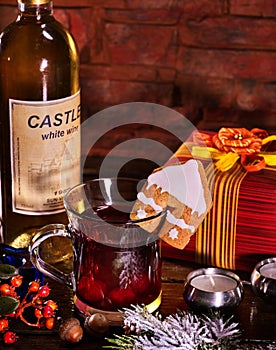 Winter warming drink decorate cookie on brick wall background.